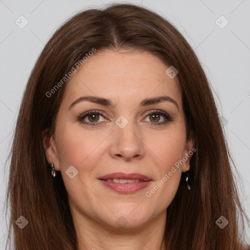 Joyful white adult female with long  brown hair and brown eyes