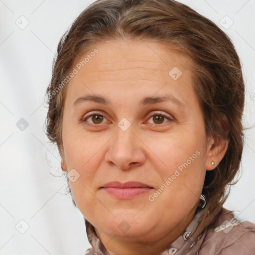 Joyful white adult female with long  brown hair and brown eyes