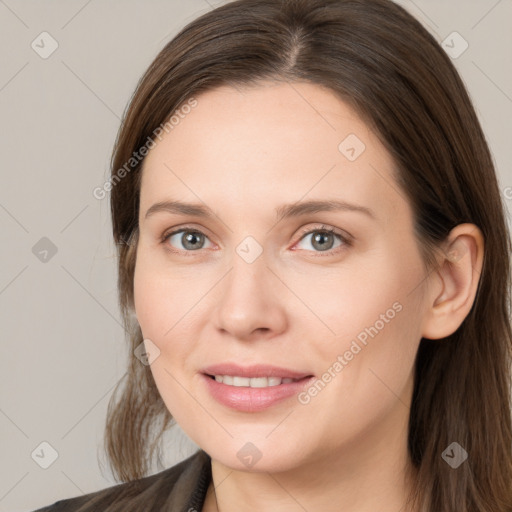 Joyful white young-adult female with medium  brown hair and grey eyes