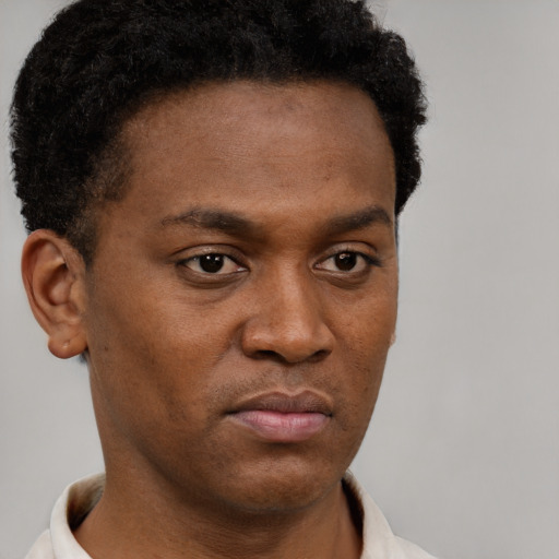 Neutral black young-adult male with short  brown hair and brown eyes