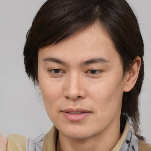 Joyful white adult female with medium  brown hair and brown eyes