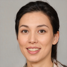 Joyful white young-adult female with medium  brown hair and brown eyes