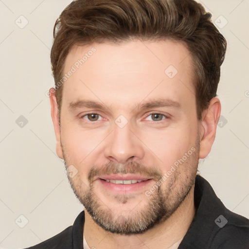 Joyful white young-adult male with short  brown hair and brown eyes