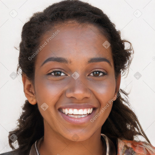 Joyful black young-adult female with long  brown hair and brown eyes