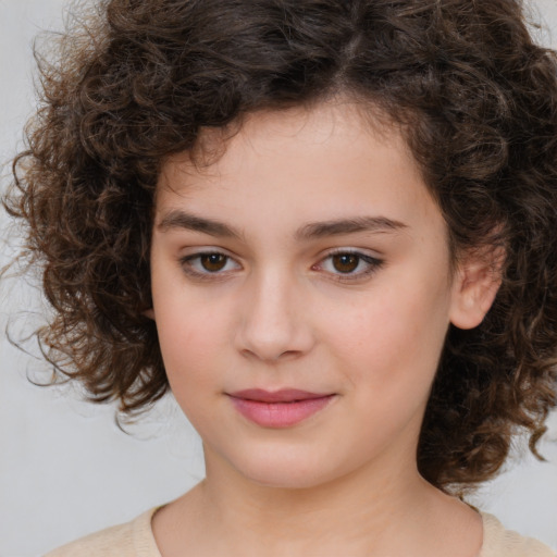 Joyful white child female with medium  brown hair and brown eyes