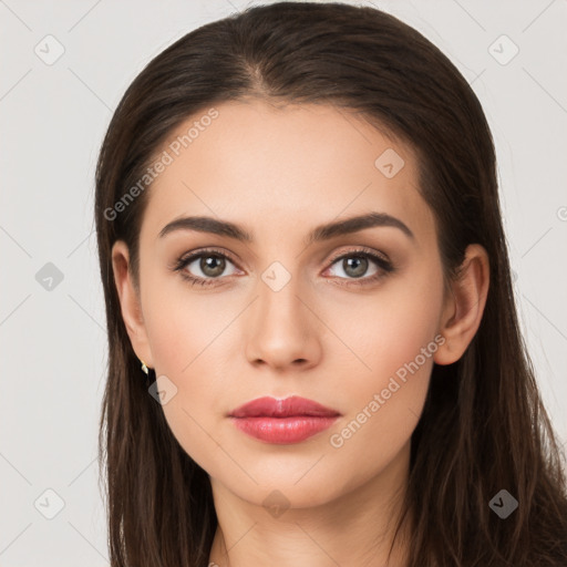 Neutral white young-adult female with long  brown hair and brown eyes