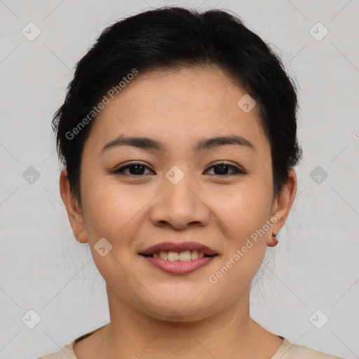 Joyful latino young-adult female with short  brown hair and brown eyes