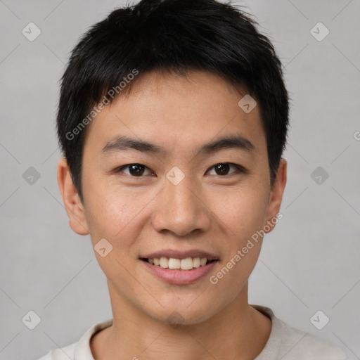 Joyful asian young-adult male with short  brown hair and brown eyes