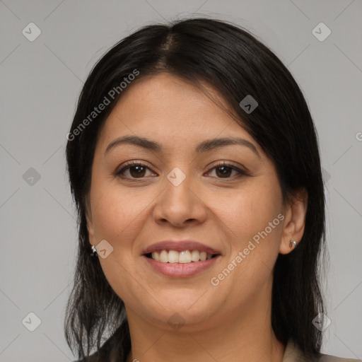 Joyful latino young-adult female with medium  brown hair and brown eyes