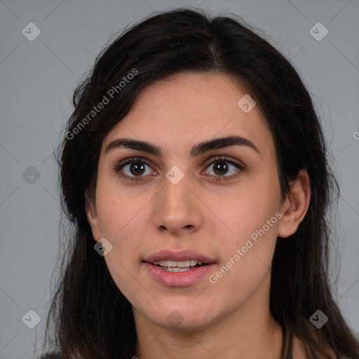 Joyful white young-adult female with long  brown hair and brown eyes