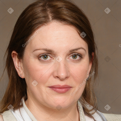 Joyful white adult female with medium  brown hair and blue eyes