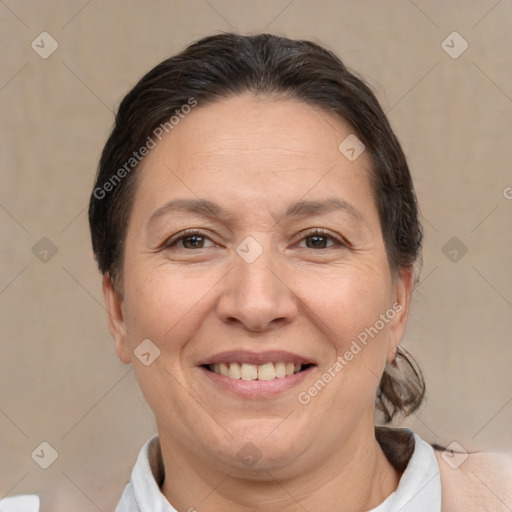 Joyful white adult female with short  brown hair and brown eyes