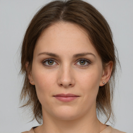 Neutral white young-adult female with medium  brown hair and grey eyes