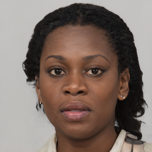 Neutral black young-adult female with medium  black hair and brown eyes