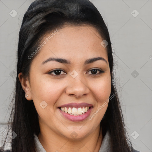 Joyful latino young-adult female with long  brown hair and brown eyes