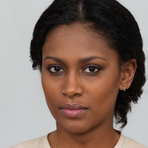 Neutral black young-adult female with short  black hair and brown eyes