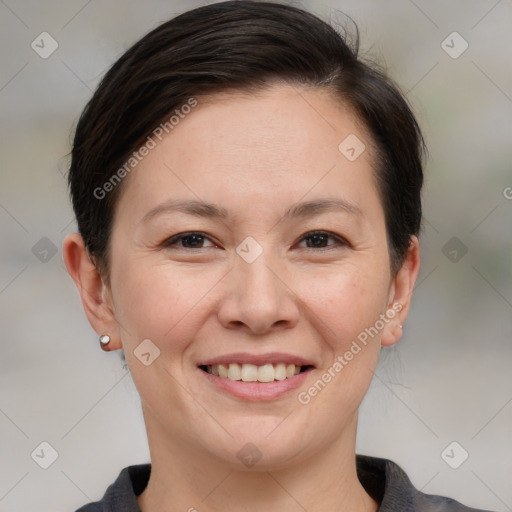 Joyful white adult female with short  brown hair and brown eyes