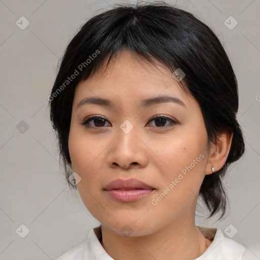 Joyful asian young-adult female with medium  brown hair and brown eyes