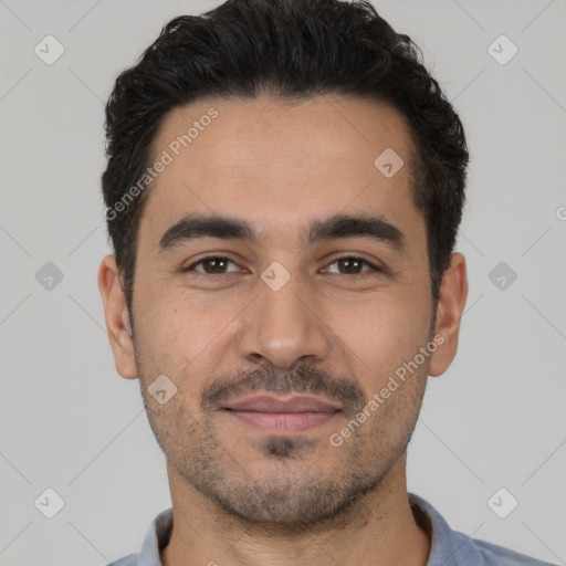 Joyful white young-adult male with short  black hair and brown eyes