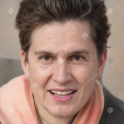 Joyful white adult male with medium  brown hair and brown eyes