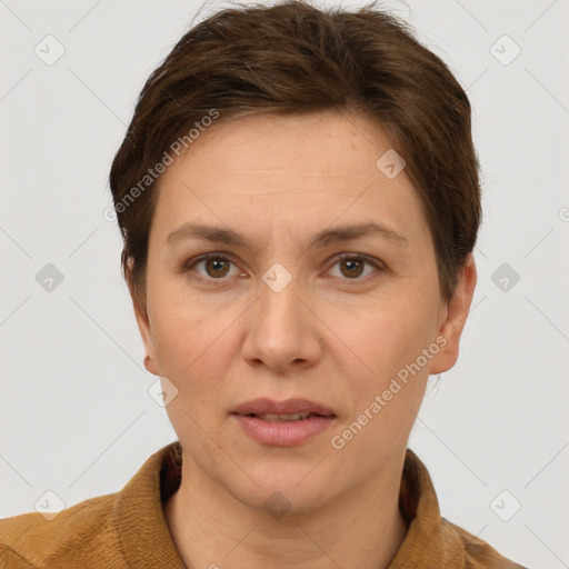 Joyful white adult female with short  brown hair and grey eyes