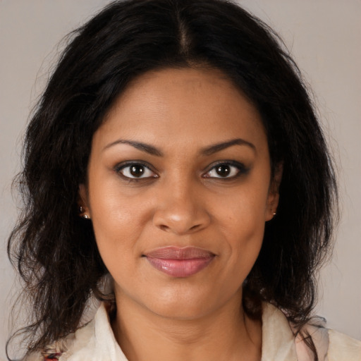 Joyful black young-adult female with medium  brown hair and brown eyes