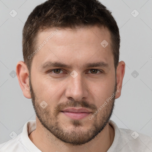 Joyful white young-adult male with short  brown hair and brown eyes