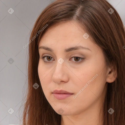 Neutral white young-adult female with long  brown hair and brown eyes