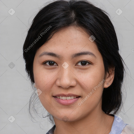 Joyful asian young-adult female with medium  black hair and brown eyes