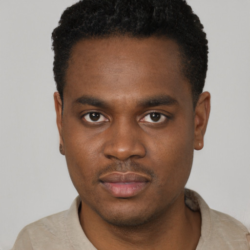 Neutral black young-adult male with short  black hair and brown eyes
