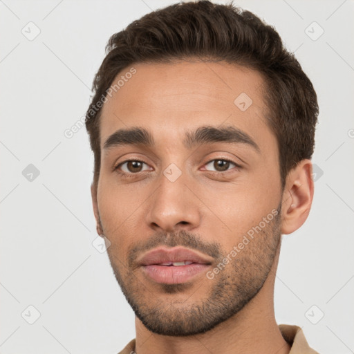 Neutral white young-adult male with short  brown hair and brown eyes