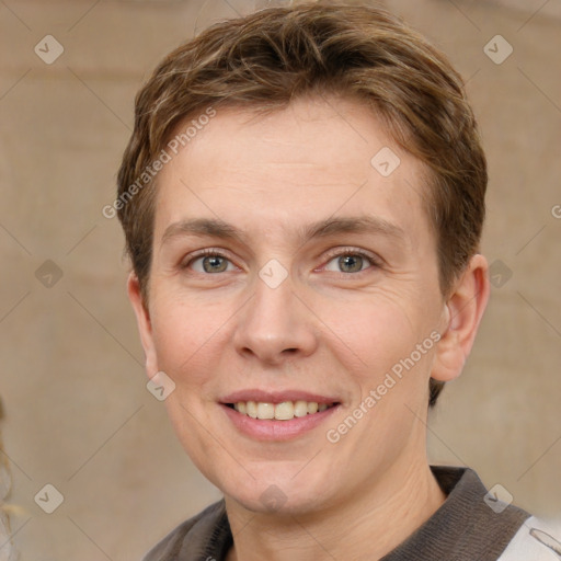 Joyful white adult female with short  brown hair and grey eyes