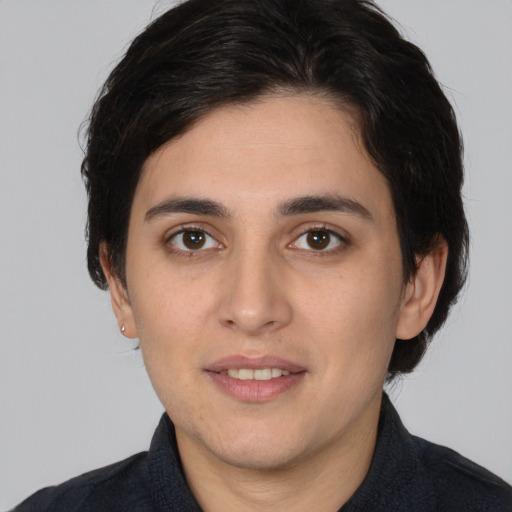 Joyful white young-adult female with medium  black hair and brown eyes