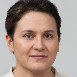 Joyful white adult female with short  brown hair and brown eyes