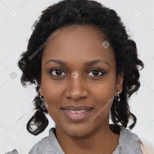 Joyful black young-adult female with long  black hair and brown eyes