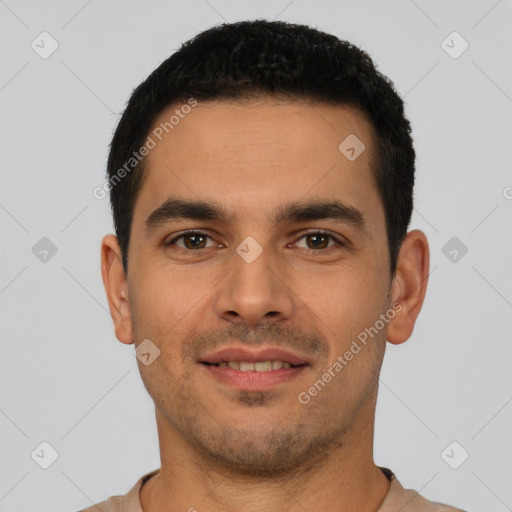 Joyful latino young-adult male with short  black hair and brown eyes