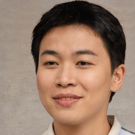 Joyful asian young-adult female with short  brown hair and brown eyes