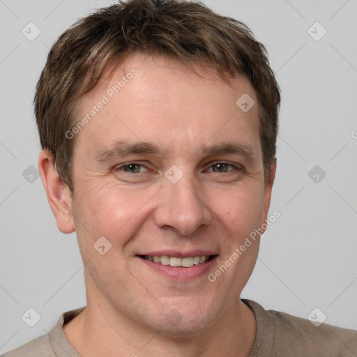 Joyful white adult male with short  brown hair and grey eyes