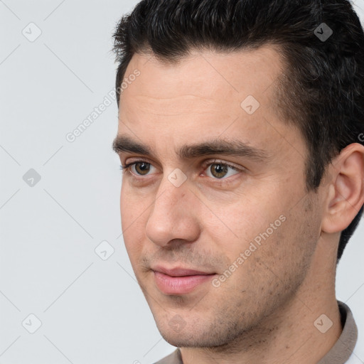 Joyful white young-adult male with short  brown hair and brown eyes