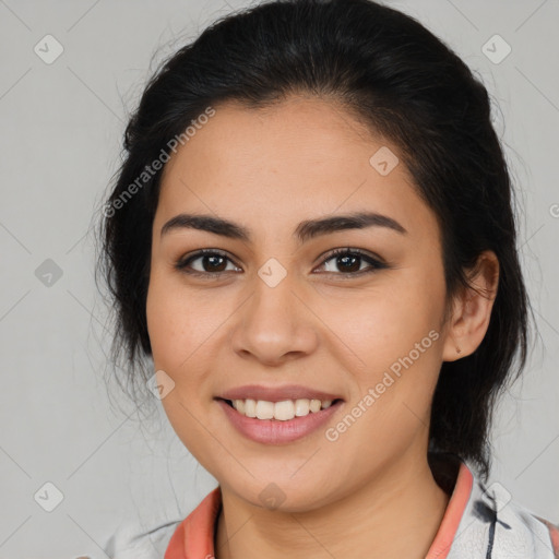 Joyful latino young-adult female with medium  brown hair and brown eyes