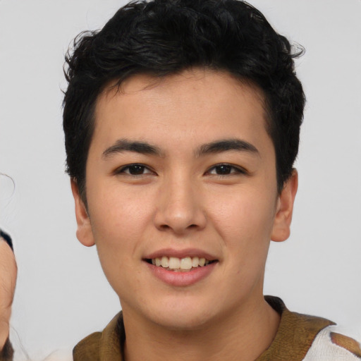 Joyful asian young-adult male with short  black hair and brown eyes