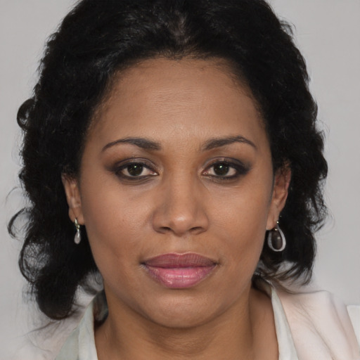 Joyful black young-adult female with medium  brown hair and brown eyes
