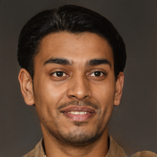 Joyful latino young-adult male with short  brown hair and brown eyes