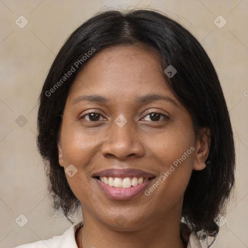 Joyful latino adult female with medium  brown hair and brown eyes