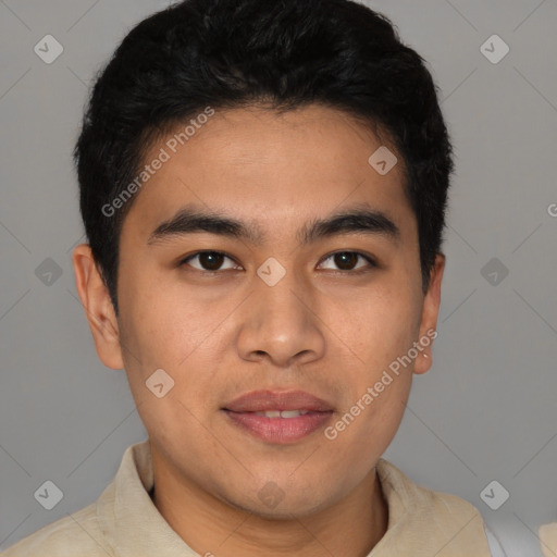 Joyful latino young-adult male with short  brown hair and brown eyes