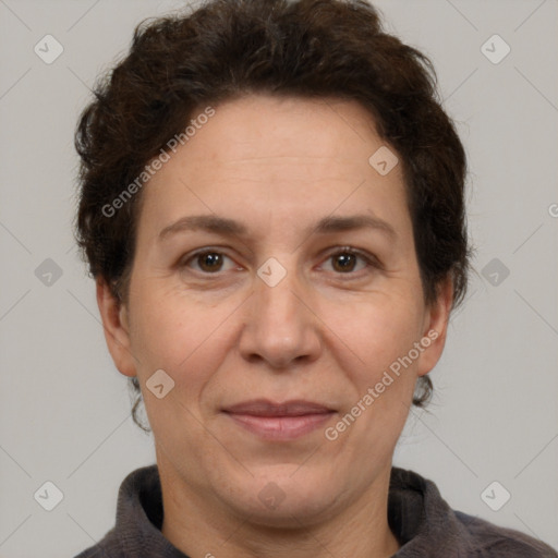 Joyful white adult female with short  brown hair and brown eyes