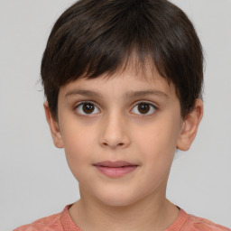 Joyful white child male with short  brown hair and brown eyes