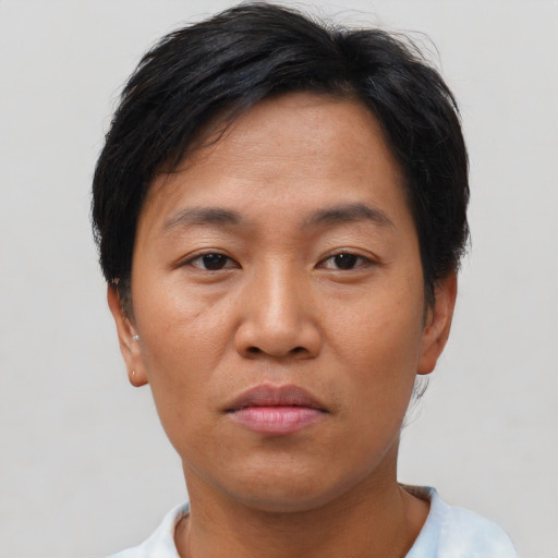 Neutral asian adult female with short  brown hair and brown eyes