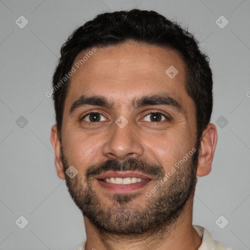 Joyful white young-adult male with short  black hair and brown eyes