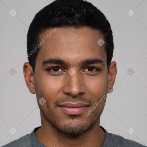 Joyful black young-adult male with short  black hair and brown eyes